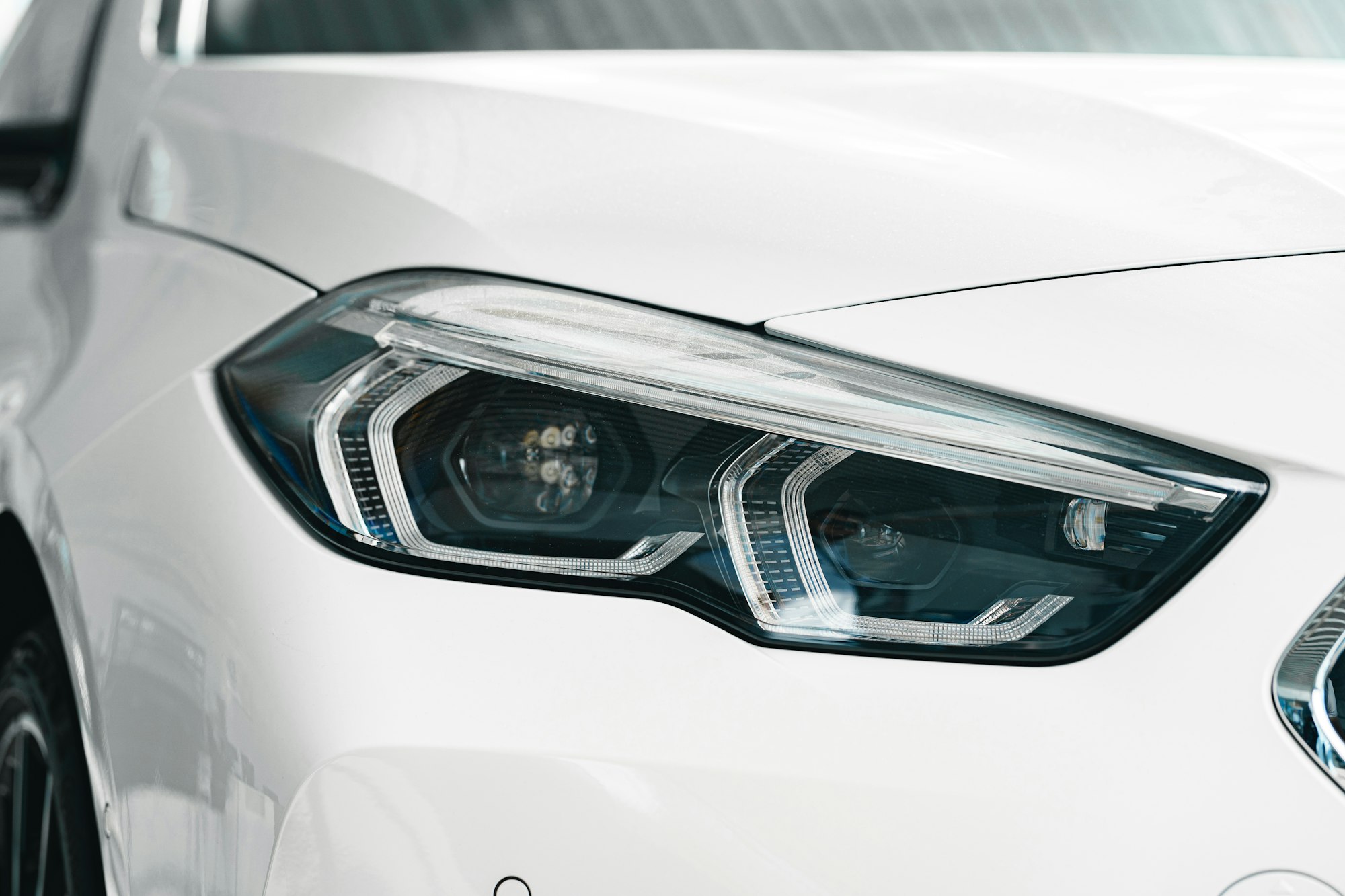 Headlights of a new white luxury car